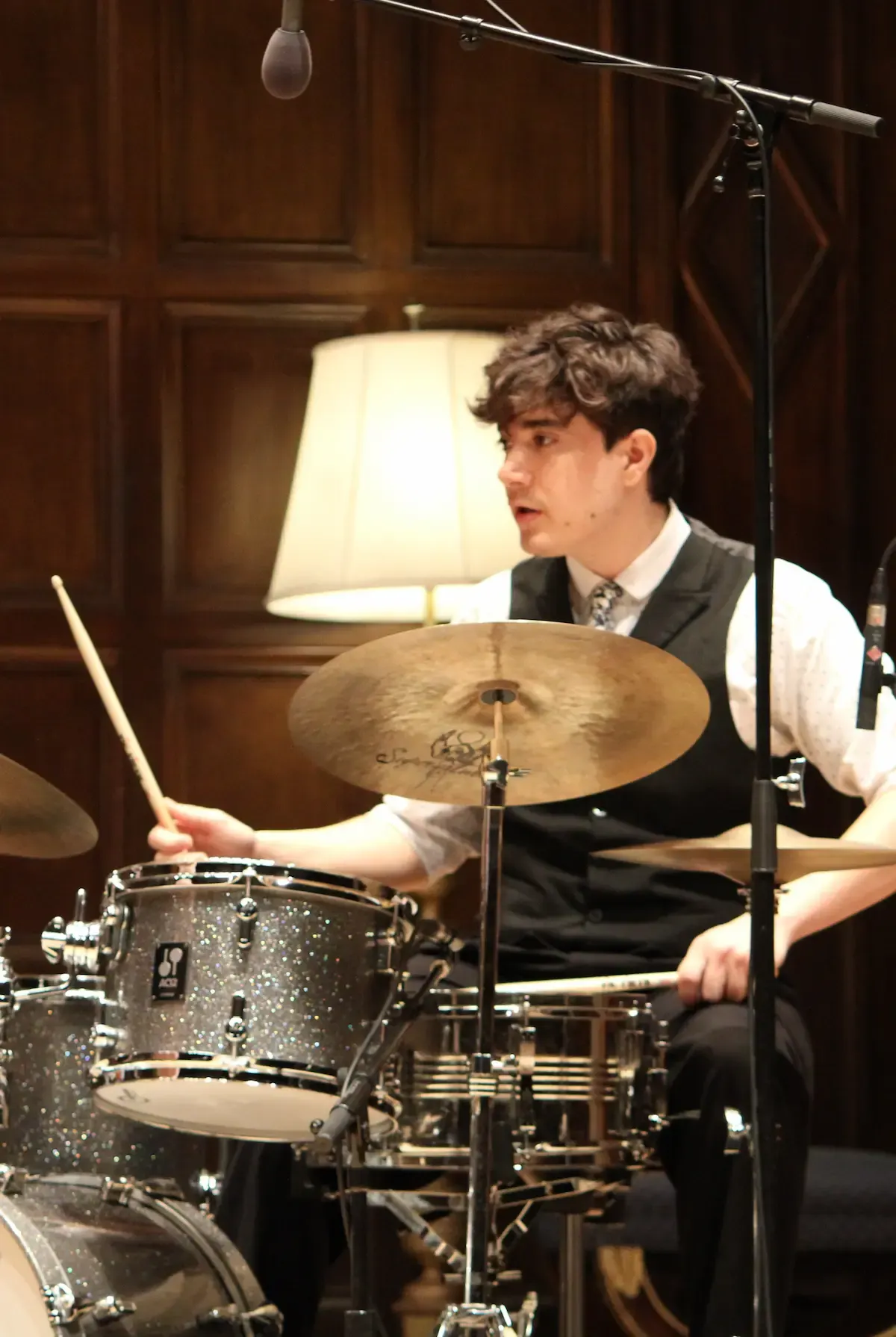 Jacobo Vega-Albela playing drums on a concert hall stage